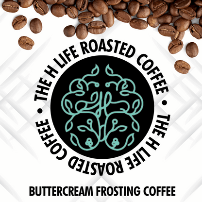 On a white textured background there are coffee beans spilling from the top and The H Life brain logo in the center. The H Life Roasted Coffee lineup highlighting the Buttercream Frosting Coffee product.